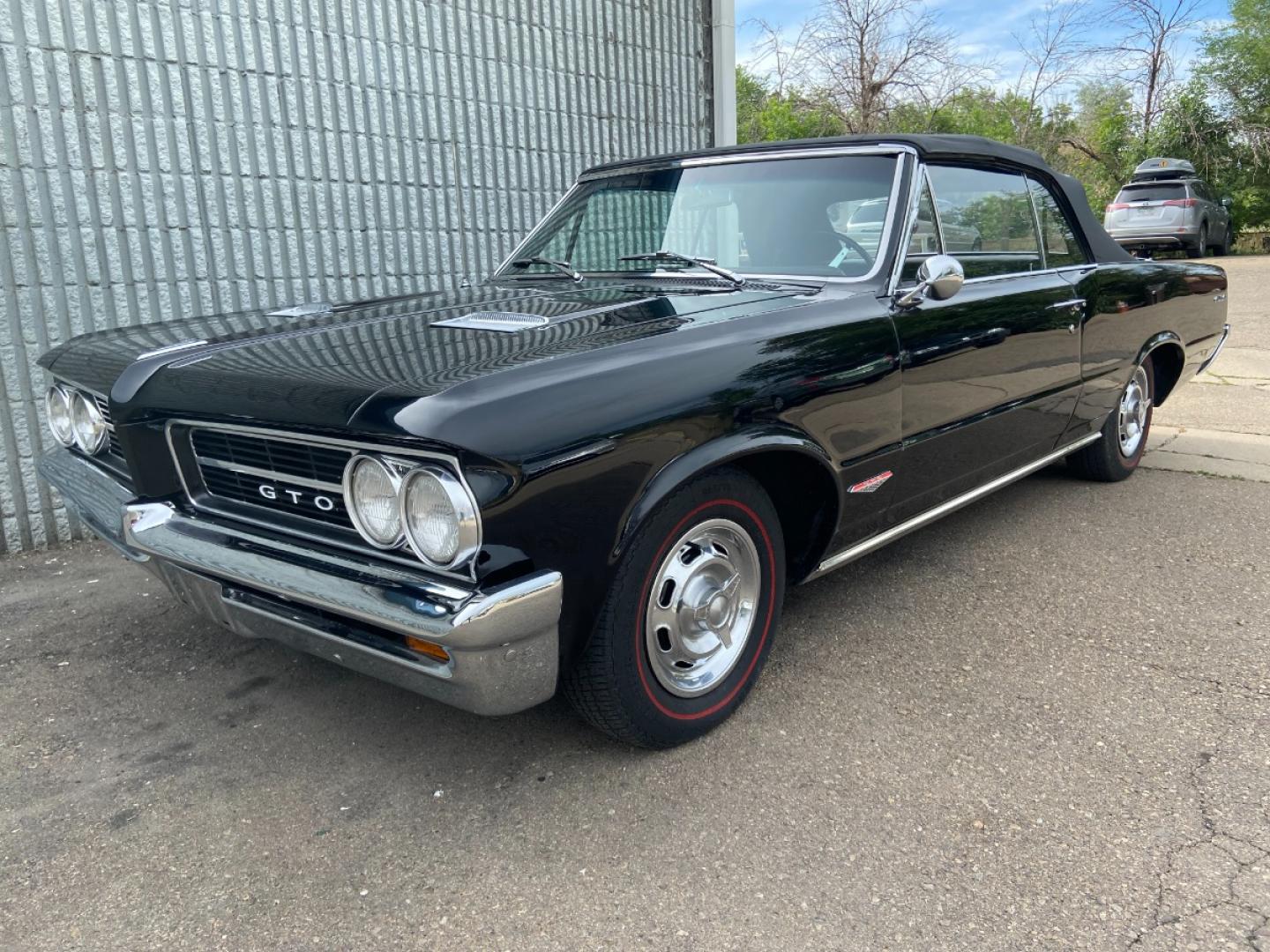 1964 Black /Black Pontiac GTO GTO Convertible Tri-Power (824B1318200) with an 389 cu. in. V8 engine, 4 Speed Manual transmission, located at 2510 47th St. Suite 200, Boulder, CO, 80301, (303) 641-0333, 40.026196, -105.243217 - "BIRTH of the MUSCLE CAR", March 1964 Car and Driver 0 to 60 mph 4.6 sec. 1964 Pontiac GTO. PHS Documented Correct. "Possibly ONE of ONE Ordered with these Specs", No PS or PB., Jim Mattison President, Pontiac Historical Services. "Maybe 10 Triple Black Tri-Power, 4 Speed Convertibles wer - Photo#9