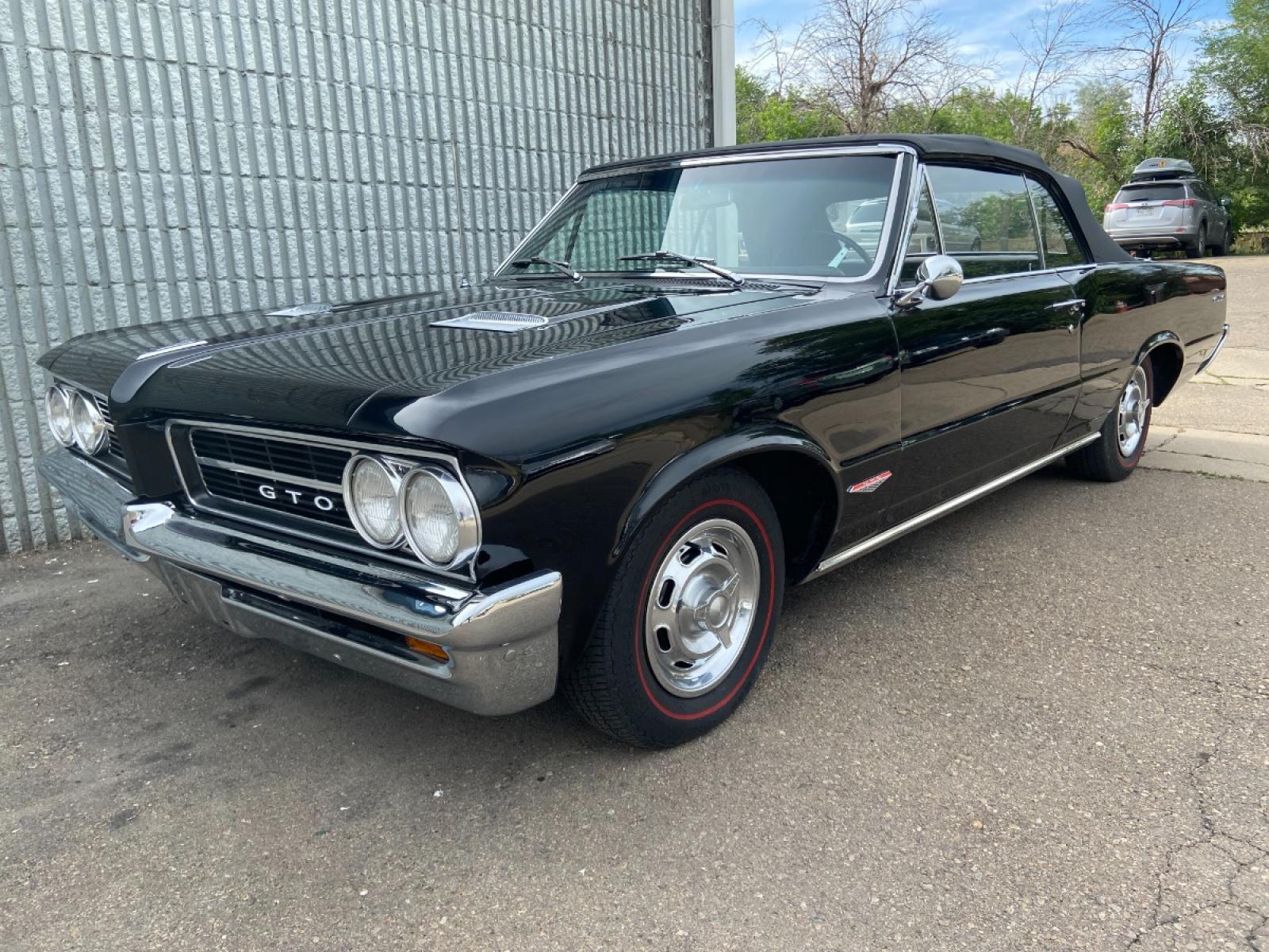 1964 Black /Black Pontiac GTO GTO Convertible Tri-Power (824B1318200) with an 389 cu. in. V8 engine, 4 Speed transmission, located at 2510 47th St. Suite 200, Boulder, CO, 80301, (303) 641-0333, 40.026196, -105.243217 - "BIRTH of the MUSCLE CAR", March 1964 Car and Driver 0 to 60 mph 4.6 sec. 1964 Pontiac GTO. PHS Documented Correct. "Possibly ONE of ONE Ordered with these Specs", No PS or PB., Jim Mattison President, Pontiac Historical Services. "Maybe 10 Triple Black Tri-Power, 4 Speed Convertibles wer - Photo #9