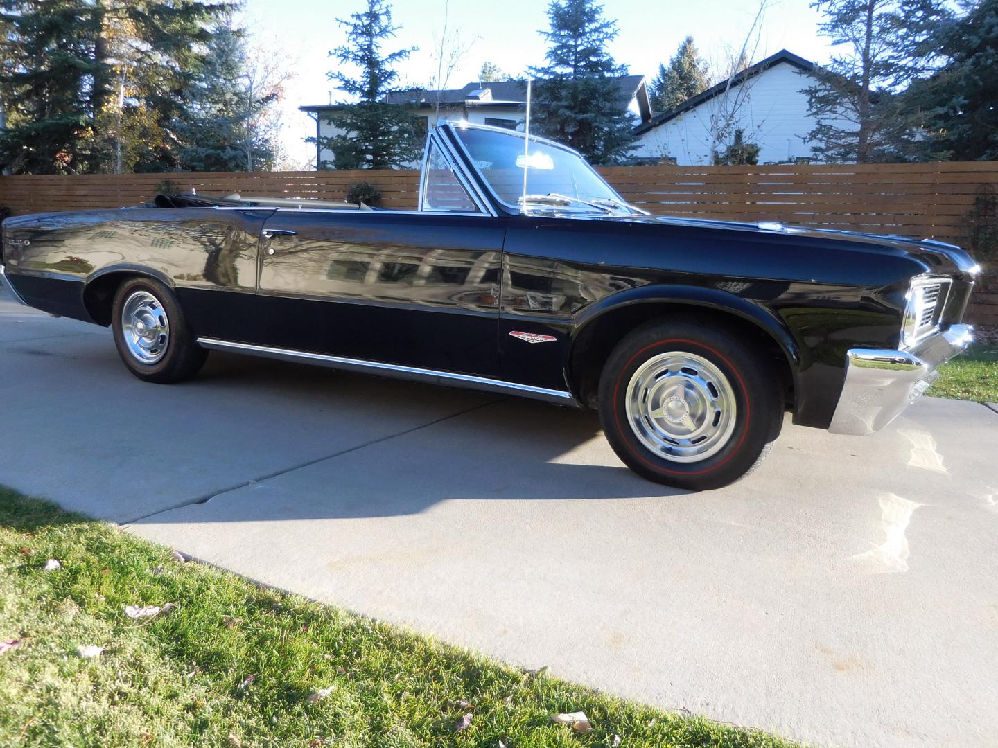 1964 Black /Black Pontiac GTO GTO Convertible Tri-Power (824B1318200) with an 389 cu. in. V8 engine, 4 Speed Manual transmission, located at 2510 47th St. Suite 200, Boulder, CO, 80301, (303) 641-0333, 40.026196, -105.243217 - "BIRTH of the MUSCLE CAR", March 1964 Car and Driver 0 to 60 mph 4.6 sec. 1964 Pontiac GTO. PHS Documented Correct. "Possibly ONE of ONE Ordered with these Specs", No PS or PB., Jim Mattison President, Pontiac Historical Services. "Maybe 10 Triple Black Tri-Power, 4 Speed Convertibles wer - Photo#8