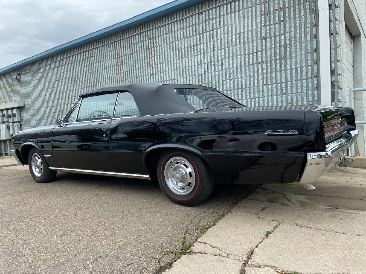 1964 Black /Black Pontiac GTO GTO Convertible Tri-Power (824B1318200) with an 389 cu. in. V8 engine, 4 Speed Manual transmission, located at 2510 47th St. Suite 200, Boulder, CO, 80301, (303) 641-0333, 40.026196, -105.243217 - "BIRTH of the MUSCLE CAR", March 1964 Car and Driver 0 to 60 mph 4.6 sec. 1964 Pontiac GTO. PHS Documented Correct. "Possibly ONE of ONE Ordered with these Specs", No PS or PB., Jim Mattison President, Pontiac Historical Services. "Maybe 10 Triple Black Tri-Power, 4 Speed Convertibles wer - Photo#10