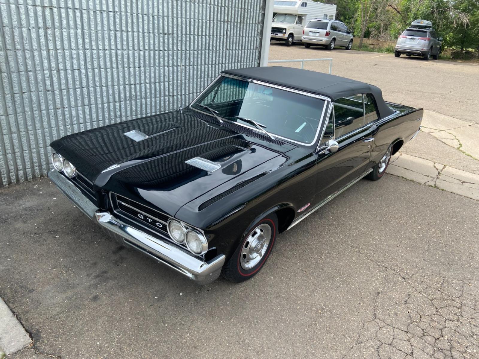 1964 Black /Black Pontiac GTO GTO Convertible Tri-Power (824B1318200) with an 389 cu. in. V8 engine, 4 Speed transmission, located at 2510 47th St. Suite 200, Boulder, CO, 80301, (303) 641-0333, 40.026196, -105.243217 - "BIRTH of the MUSCLE CAR", March 1964 Car and Driver 0 to 60 mph 4.6 sec. 1964 Pontiac GTO. PHS Documented Correct. "Possibly ONE of ONE Ordered with these Specs", No PS or PB., Jim Mattison President, Pontiac Historical Services. "Maybe 10 Triple Black Tri-Power, 4 Speed Convertibles wer - Photo #11