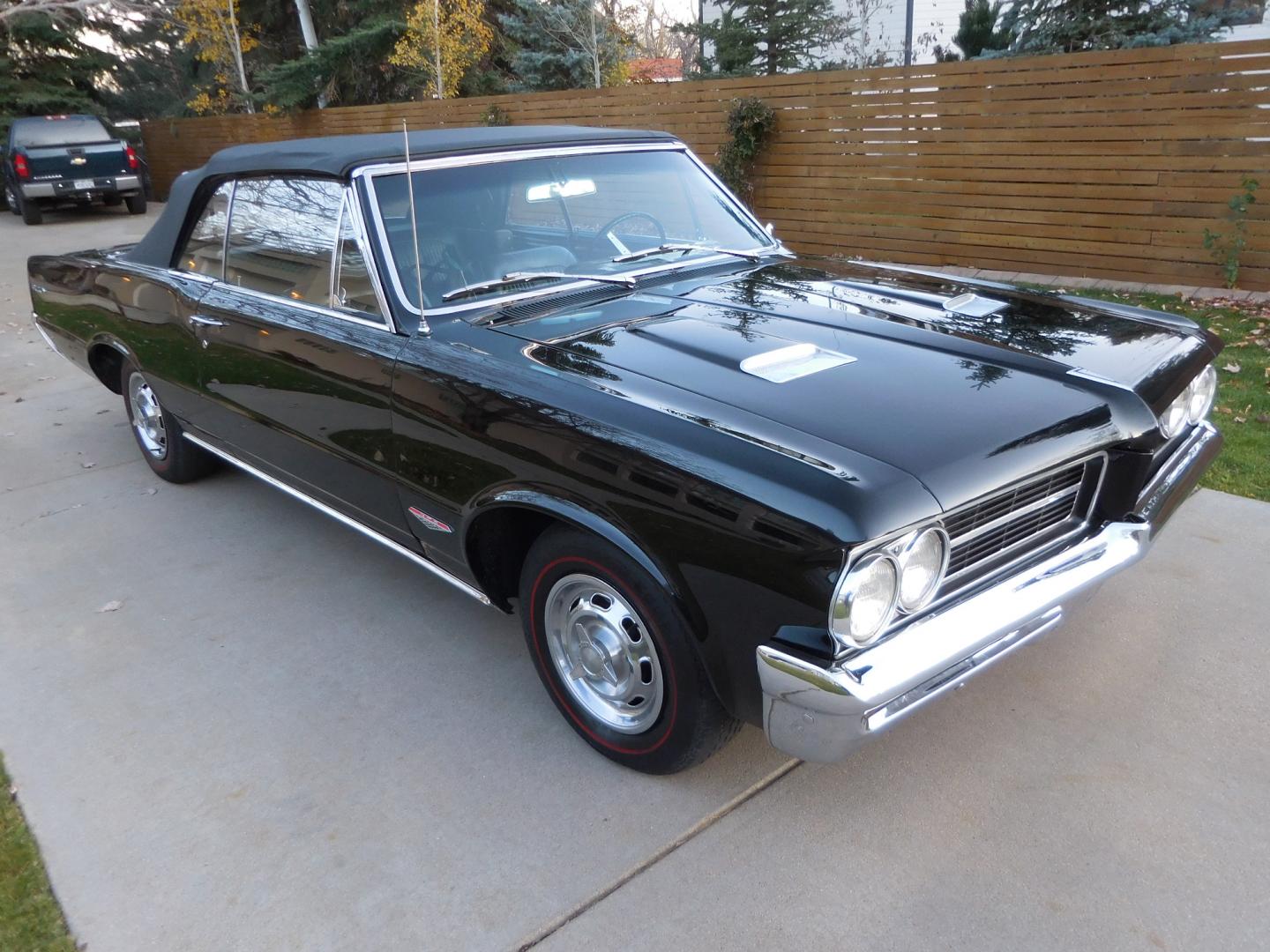 1964 Black /Black Pontiac GTO GTO Convertible Tri-Power (824B1318200) with an 389 cu. in. V8 engine, 4 Speed Manual transmission, located at 2510 47th St. Suite 200, Boulder, CO, 80301, (303) 641-0333, 40.026196, -105.243217 - "BIRTH of the MUSCLE CAR", March 1964 Car and Driver 0 to 60 mph 4.6 sec. 1964 Pontiac GTO. PHS Documented Correct. "Possibly ONE of ONE Ordered with these Specs", No PS or PB., Jim Mattison President, Pontiac Historical Services. "Maybe 10 Triple Black Tri-Power, 4 Speed Convertibles wer - Photo#4