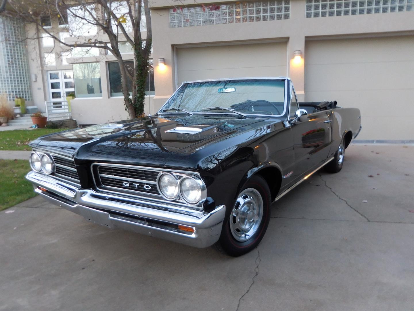 1964 Black /Black Pontiac GTO GTO Convertible Tri-Power (824B1318200) with an 389 cu. in. V8 engine, 4 Speed Manual transmission, located at 2510 47th St. Suite 200, Boulder, CO, 80301, (303) 641-0333, 40.026196, -105.243217 - "BIRTH of the MUSCLE CAR", March 1964 Car and Driver 0 to 60 mph 4.6 sec. 1964 Pontiac GTO. PHS Documented Correct. "Possibly ONE of ONE Ordered with these Specs", No PS or PB., Jim Mattison President, Pontiac Historical Services. "Maybe 10 Triple Black Tri-Power, 4 Speed Convertibles wer - Photo#1