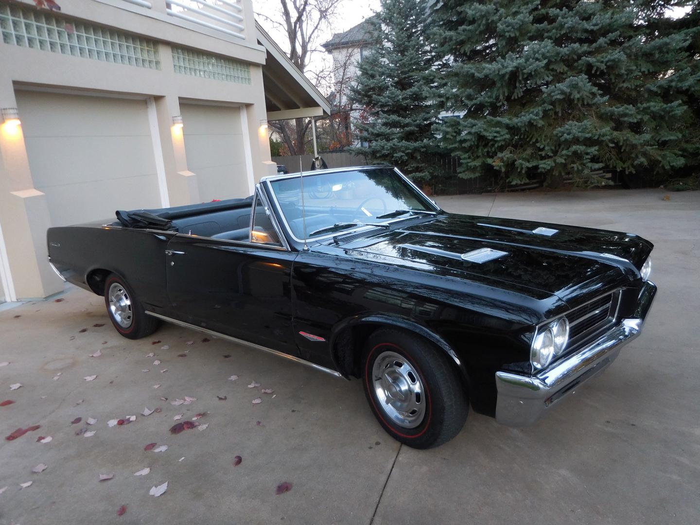 1964 Black /Black Pontiac GTO GTO Convertible Tri-Power (824B1318200) with an 389 cu. in. V8 engine, 4 Speed Manual transmission, located at 2510 47th St. Suite 200, Boulder, CO, 80301, (303) 641-0333, 40.026196, -105.243217 - "BIRTH of the MUSCLE CAR", March 1964 Car and Driver 0 to 60 mph 4.6 sec. 1964 Pontiac GTO. PHS Documented Correct. "Possibly ONE of ONE Ordered with these Specs", No PS or PB., Jim Mattison President, Pontiac Historical Services. "Maybe 10 Triple Black Tri-Power, 4 Speed Convertibles wer - Photo#5