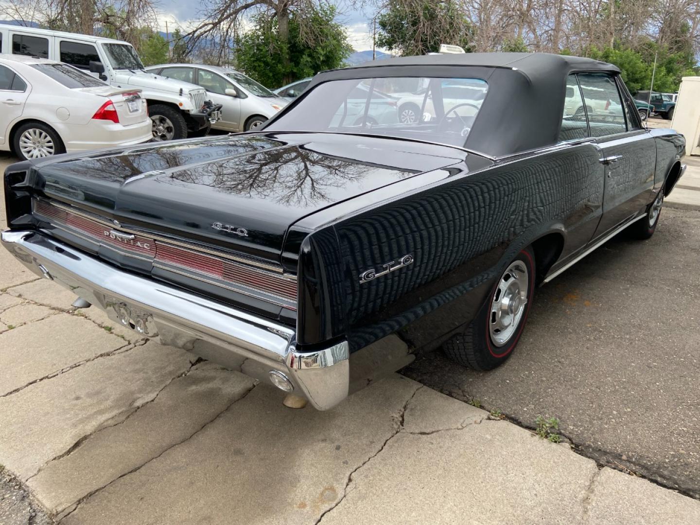 1964 Black /Black Pontiac GTO GTO Convertible Tri-Power (824B1318200) with an 389 cu. in. V8 engine, 4 Speed Manual transmission, located at 2510 47th St. Suite 200, Boulder, CO, 80301, (303) 641-0333, 40.026196, -105.243217 - "BIRTH of the MUSCLE CAR", March 1964 Car and Driver 0 to 60 mph 4.6 sec. 1964 Pontiac GTO. PHS Documented Correct. "Possibly ONE of ONE Ordered with these Specs", No PS or PB., Jim Mattison President, Pontiac Historical Services. "Maybe 10 Triple Black Tri-Power, 4 Speed Convertibles wer - Photo#12