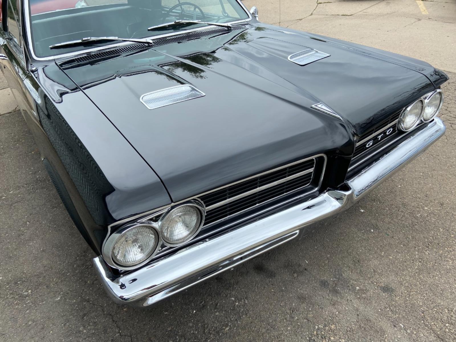 1964 Black /Black Pontiac GTO GTO Convertible Tri-Power (824B1318200) with an 389 cu. in. V8 engine, 4 Speed transmission, located at 2510 47th St. Suite 200, Boulder, CO, 80301, (303) 641-0333, 40.026196, -105.243217 - "BIRTH of the MUSCLE CAR", March 1964 Car and Driver 0 to 60 mph 4.6 sec. 1964 Pontiac GTO. PHS Documented Correct. "Possibly ONE of ONE Ordered with these Specs", No PS or PB., Jim Mattison President, Pontiac Historical Services. "Maybe 10 Triple Black Tri-Power, 4 Speed Convertibles wer - Photo #6