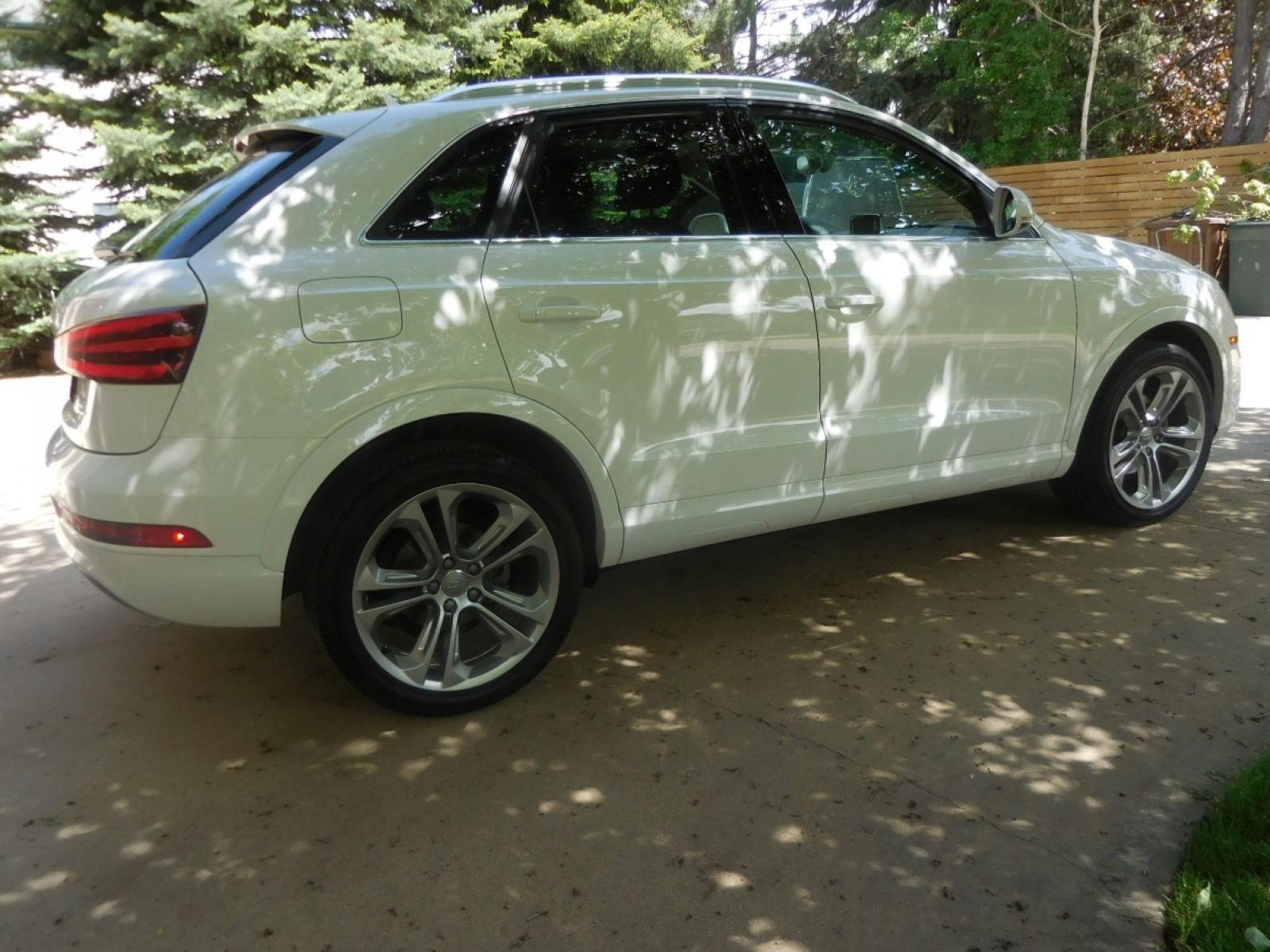 2015 White /Black Audi Q3 2.0T quattro Premium Plus (WA1EFCFS3FR) with an 2.0L L4 DOHC 24V engine, 6-Speed Automatic transmission, located at 2510 47th St. Suite 200, Boulder, CO, 80301, (303) 641-0333, 40.026196, -105.243217 - 2015 Audi Q3 2.0T Quattro Premium This Beautiful LOW Mileage, (53,800), ONE OWNER, All Wheel Drive, Non Smoker Q3 from Boulder was Recently Acquired by Boulder Motors in Boulder Colorado. It is Finished in Audis Stunning Glacier White Metallic with Onyx Black Heated Cowhide Seating. It of Cours - Photo #9