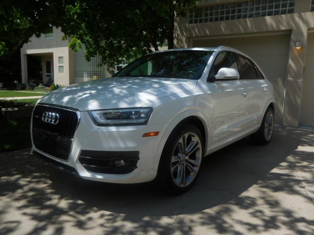 2015 White /Black Audi Q3 2.0T quattro Premium Plus (WA1EFCFS3FR) with an 2.0L L4 DOHC 24V engine, 6-Speed Automatic transmission, located at 2510 47th St. Suite 200, Boulder, CO, 80301, (303) 641-0333, 40.026196, -105.243217 - 2015 Audi Q3 2.0T Quattro Premium This Beautiful LOW Mileage, (53,800), ONE OWNER, All Wheel Drive, Non Smoker Q3 from Boulder was Recently Acquired by Boulder Motors in Boulder Colorado. It is Finished in Audis Stunning Glacier White Metallic with Onyx Black Heated Cowhide Seating. It of Cours - Photo #1