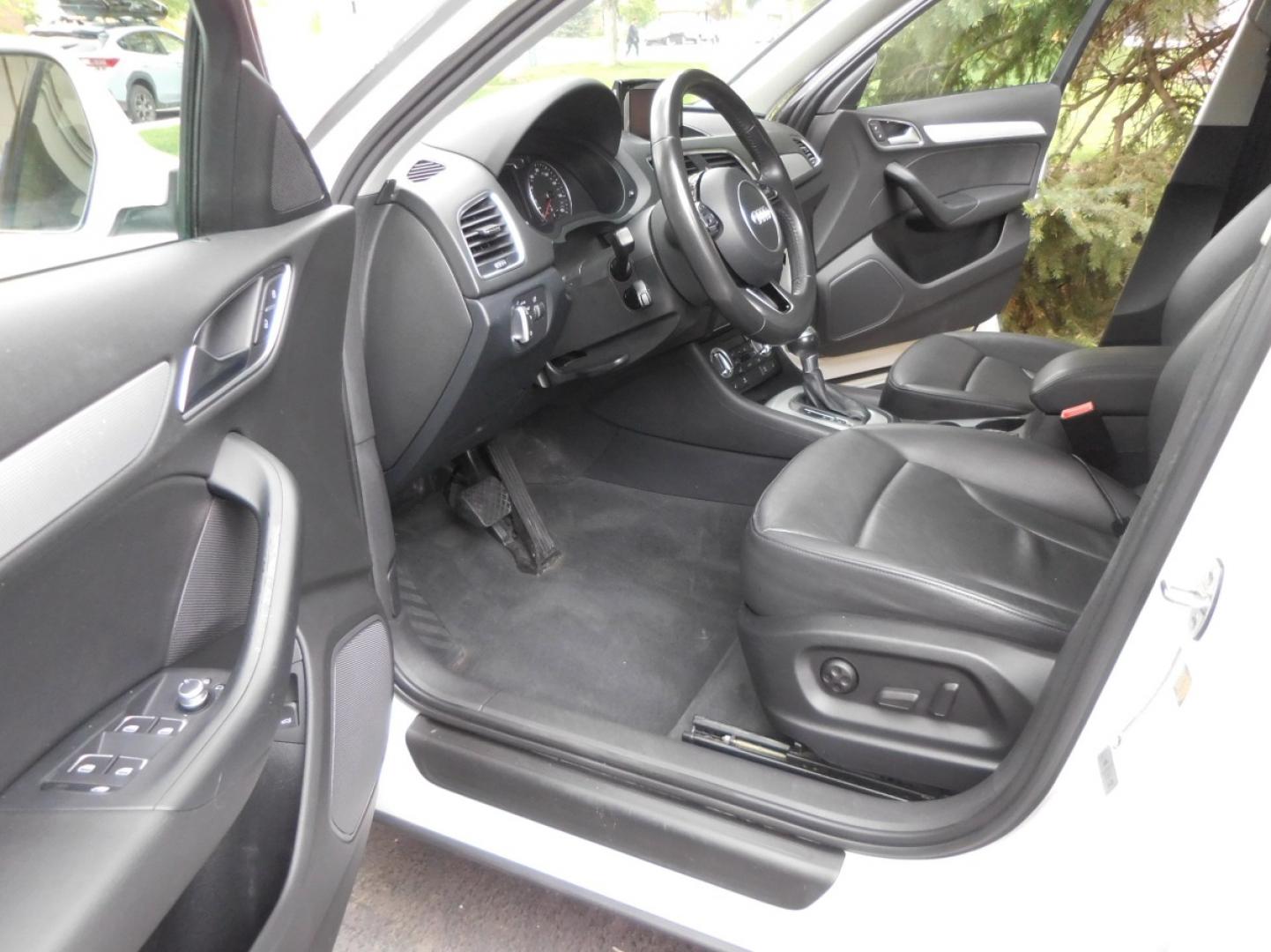 2015 White /Black Audi Q3 2.0T quattro Premium Plus (WA1EFCFS3FR) with an 2.0L L4 DOHC 24V engine, 6-Speed Automatic transmission, located at 2510 47th St. Suite 200, Boulder, CO, 80301, (303) 641-0333, 40.026196, -105.243217 - Photo#27