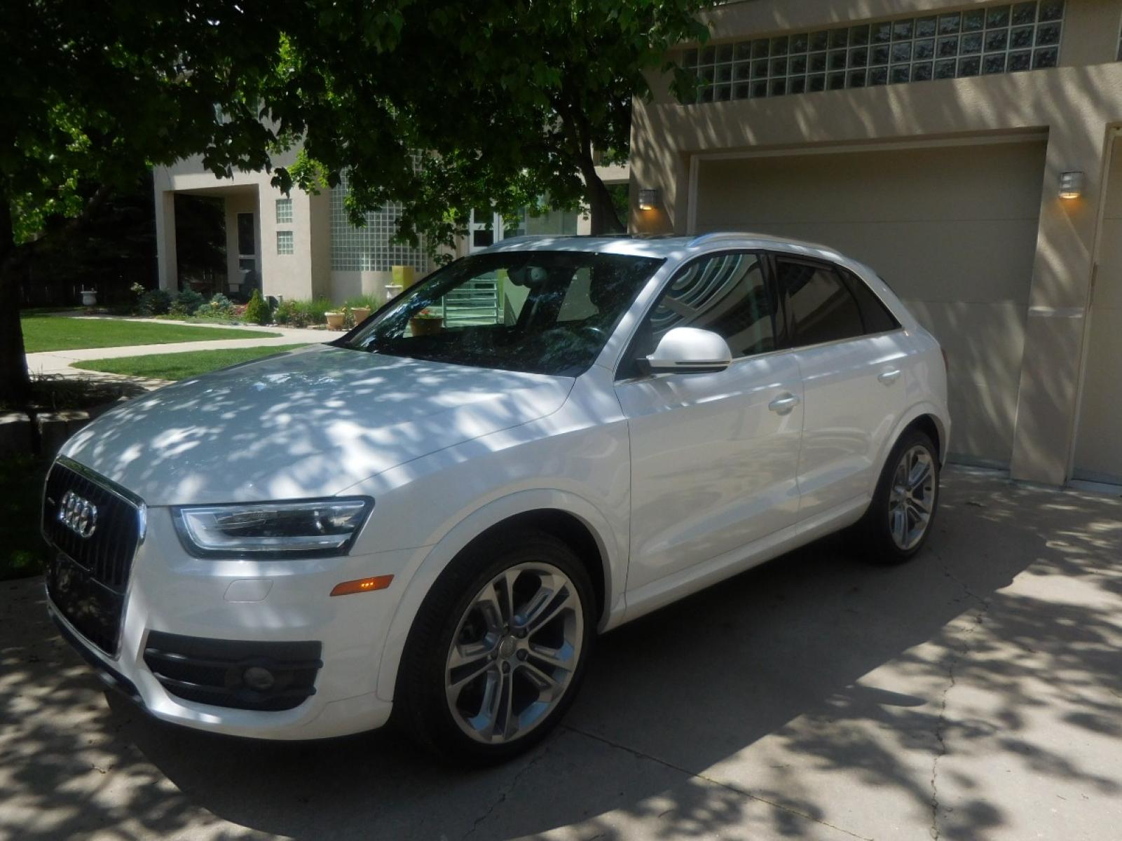 2015 White /Black Audi Q3 2.0T quattro Premium Plus (WA1EFCFS3FR) with an 2.0L L4 DOHC 24V engine, 6-Speed Automatic transmission, located at 2510 47th St. Suite 200, Boulder, CO, 80301, (303) 641-0333, 40.026196, -105.243217 - 2015 Audi Q3 2.0T Quattro Premium This Beautiful LOW Mileage, (53,800), ONE OWNER, All Wheel Drive, Non Smoker Q3 from Boulder was Recently Acquired by Boulder Motors in Boulder Colorado. It is Finished in Audis Stunning Glacier White Metallic with Onyx Black Heated Cowhide Seating. It of Cours - Photo #2