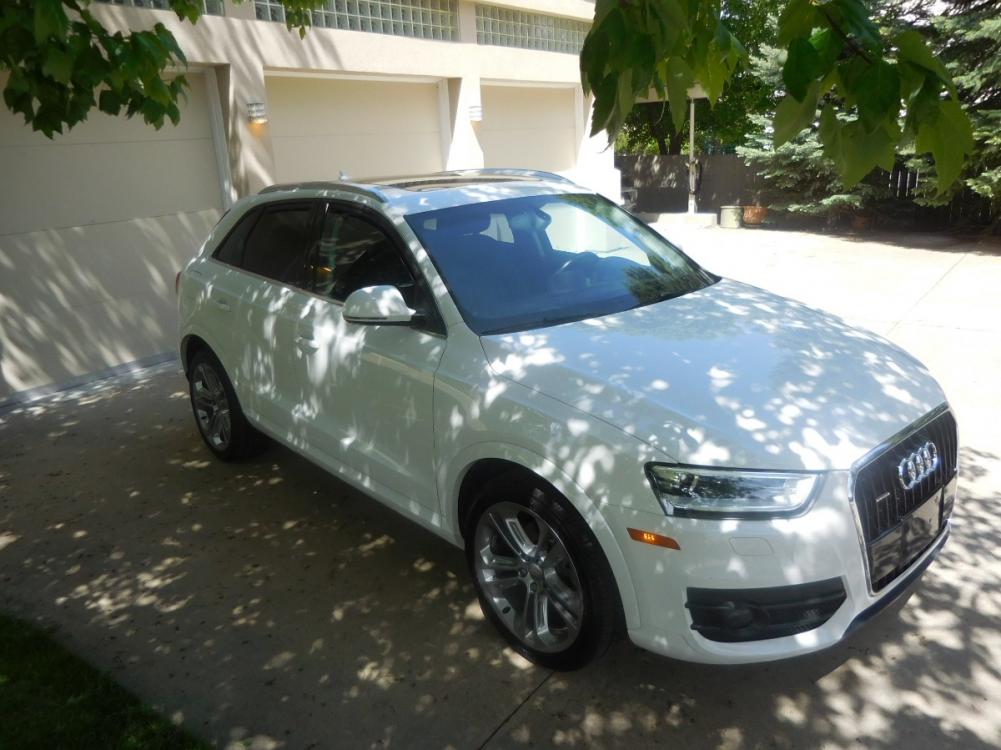 2015 White /Black Audi Q3 2.0T quattro Premium Plus (WA1EFCFS3FR) with an 2.0L L4 DOHC 24V engine, 6-Speed Automatic transmission, located at 2510 47th St. Suite 200, Boulder, CO, 80301, (303) 641-0333, 40.026196, -105.243217 - 2015 Audi Q3 2.0T Quattro Premium This Beautiful LOW Mileage, (53,800), ONE OWNER, All Wheel Drive, Non Smoker Q3 from Boulder was Recently Acquired by Boulder Motors in Boulder Colorado. It is Finished in Audis Stunning Glacier White Metallic with Onyx Black Heated Cowhide Seating. It of Cours - Photo #6