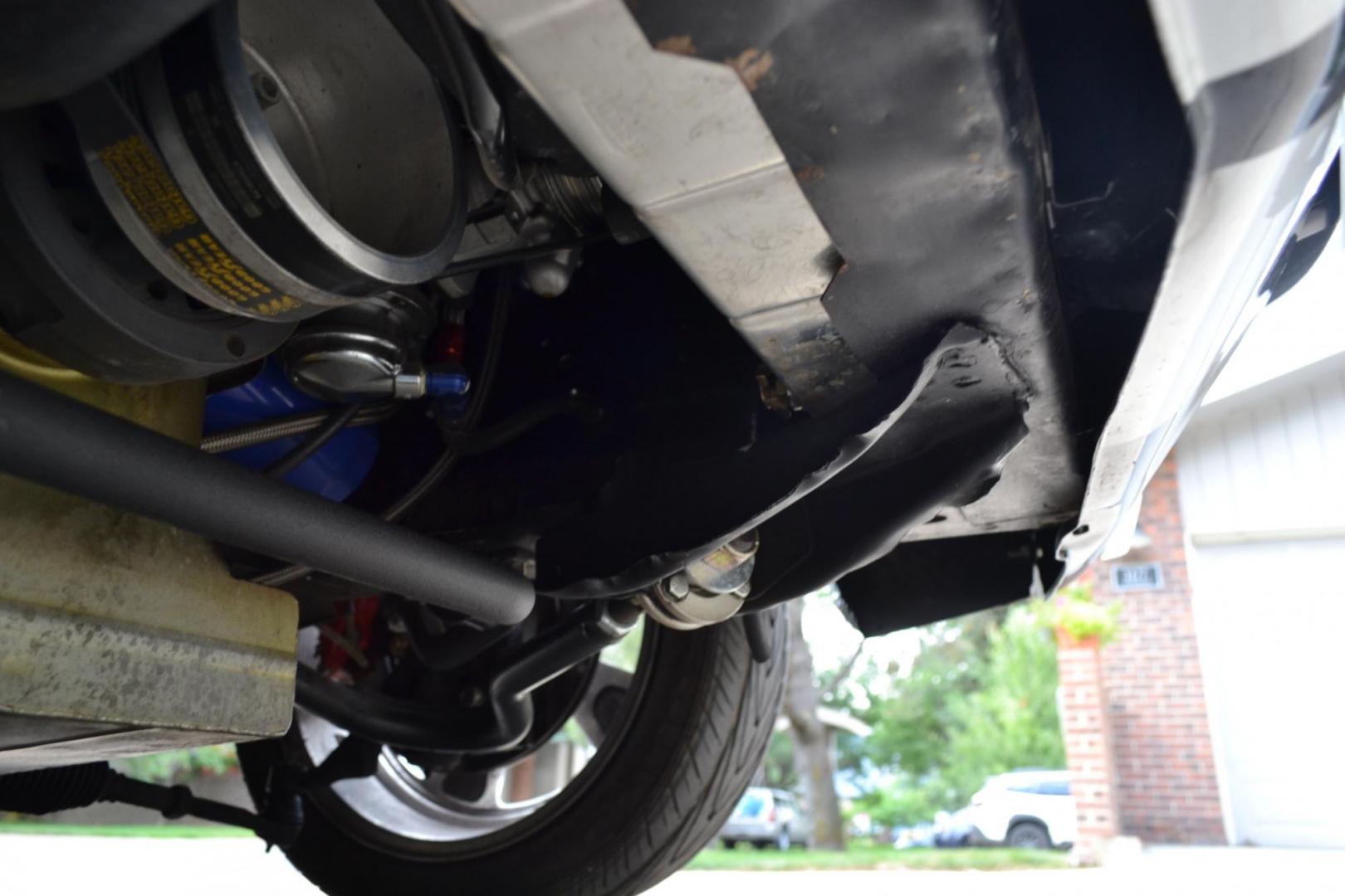 1965 Black /black Ford Mustang Standard (5F07A668786) with an 306ci engine, Manual transmission, located at 2510 47th St. Suite 200, Boulder, CO, 80301, (303) 641-0333, 40.026196, -105.243217 - This Custom Pro-Touring 1965 Mustang Coupe is Powered by a Newly Built 306ci Roller Engine with High Performance Cam, Roller Rockers and Aluminum Heads and Intake, (Edlebrock), Backed by a Tremec T5 5-Speed Manual Transmission and a Ford 9-inch Posi-Traction Rear Axle. It exhales through Ceramic Co - Photo#93