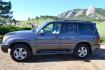 2006 Gray /Gray Lexus LX 470 Sport Utility (JTJHT00W464) with an 4.7L V8 DOHC 32V engine, 5-Speed Automatic Overdrive transmission, located at 2510 47th St. Suite 200, Boulder, CO, 80301, (303) 641-0333, 40.026196, -105.243217 - This Great One Owner, Low Mile, Non Smoker Female Driven LX470 is a New Lexus Trade in Recently Acquired by Boulder Motors of Boulder Colorado. It is Finished in Lexus Galactic Gray Mica with Gray Interior. A Flawless CarFax and AutoCheck Showing No Accidents, Odometer or Problems Reported EVER acc - Photo#4