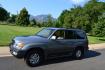 2002 Green /Gray Lexus LX 470 Sport Utility (JTJHT00W623) with an 4.7L V8 DOHC 32V engine, 4-Speed Automatic Overdrive transmission, located at 2510 47th St. Suite 200, Boulder, CO, 80301, (303) 641-0333, 40.026196, -105.243217 - Photo#1