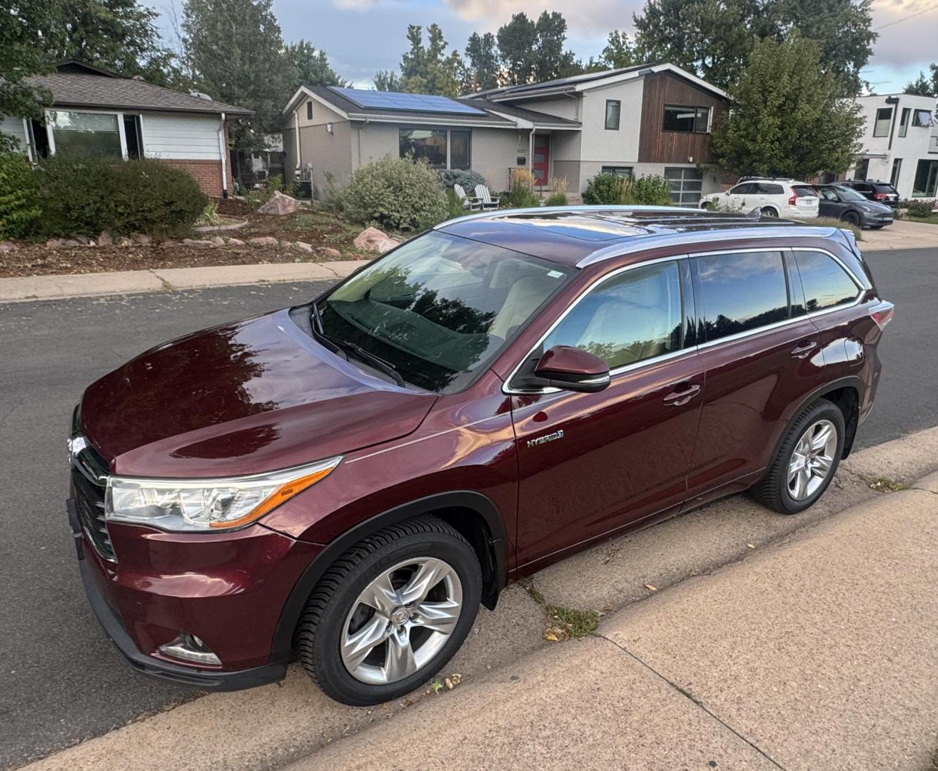 2015 Red /Tan Toyota Highlander Hybrid Limited AWD (5TDDCRFH9FS) with an 3.3L V6 DOHC 24V HYBRID engine, Continuously Variable Transmission transmission, located at 2510 47th St. Suite 200, Boulder, CO, 80301, (303) 641-0333, 40.026196, -105.243217 - This Beautiful 2015 Toyota Highlander Hybrid Limited is a recent acquisition by Boulder Motors. It is finished in Toyota’s Ooh La La Rouge Mica with Almond Perforated Leather. The Colorado title is Clean Clear. Some Features: Color-keyed rear spoiler with LED center high-mount stop light · - Photo#1