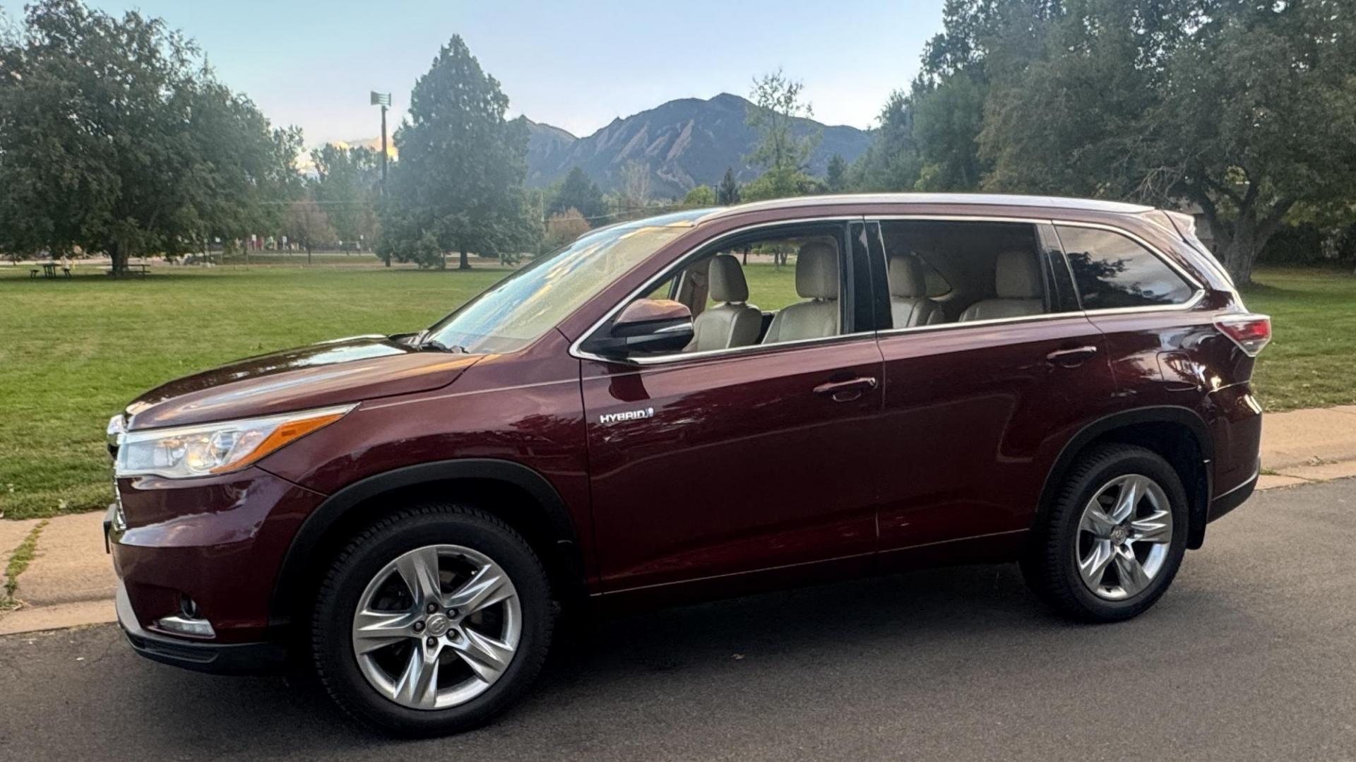 2015 Red /Tan Toyota Highlander Hybrid Limited AWD (5TDDCRFH9FS) with an 3.3L V6 DOHC 24V HYBRID engine, Continuously Variable Transmission transmission, located at 2510 47th St. Suite 200, Boulder, CO, 80301, (303) 641-0333, 40.026196, -105.243217 - This Beautiful 2015 Toyota Highlander Hybrid Limited is a recent acquisition by Boulder Motors. It is finished in Toyota’s Ooh La La Rouge Mica with Almond Perforated Leather. The Colorado title is Clean Clear. Some Features: Color-keyed rear spoiler with LED center high-mount stop light · - Photo#3
