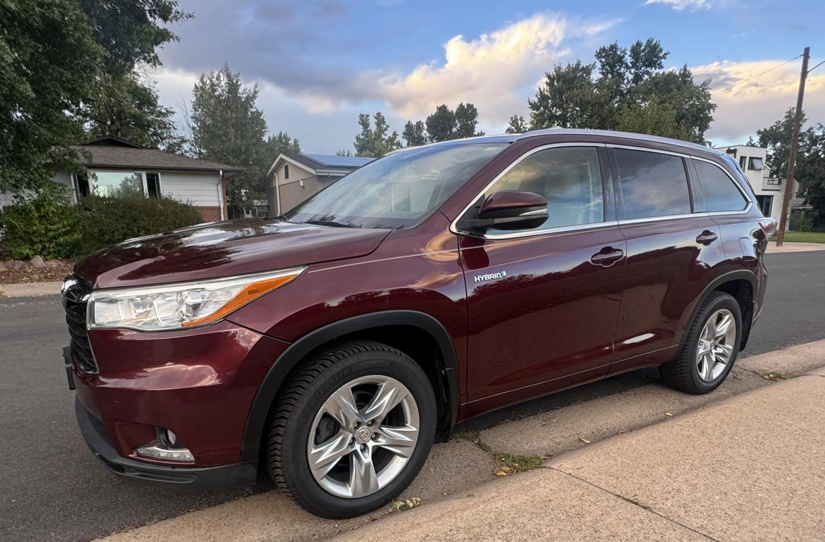 2015 Red /Tan Toyota Highlander Hybrid Limited AWD (5TDDCRFH9FS) with an 3.3L V6 DOHC 24V HYBRID engine, Continuously Variable Transmission transmission, located at 2510 47th St. Suite 200, Boulder, CO, 80301, (303) 641-0333, 40.026196, -105.243217 - This Beautiful 2015 Toyota Highlander Hybrid Limited is a recent acquisition by Boulder Motors. It is finished in Toyota’s Ooh La La Rouge Mica with Almond Perforated Leather. The Colorado title is Clean Clear. Some Features: Color-keyed rear spoiler with LED center high-mount stop light · - Photo#4