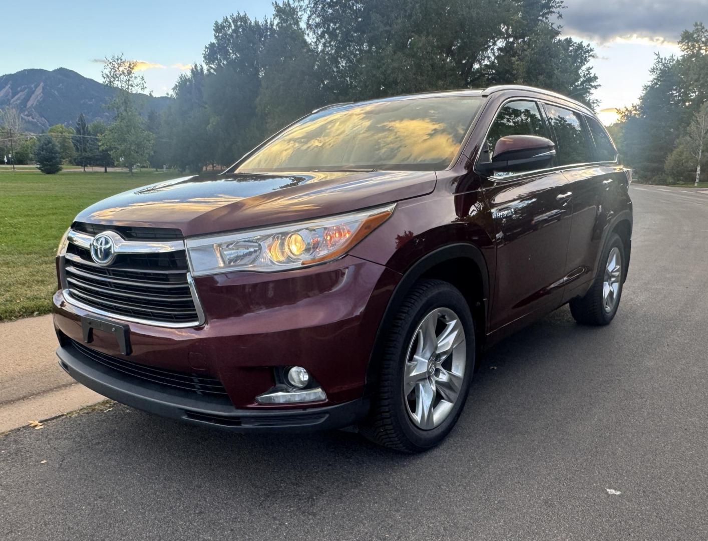 2015 Red /Tan Toyota Highlander Hybrid Limited AWD (5TDDCRFH9FS) with an 3.3L V6 DOHC 24V HYBRID engine, Continuously Variable Transmission transmission, located at 2510 47th St. Suite 200, Boulder, CO, 80301, (303) 641-0333, 40.026196, -105.243217 - This Beautiful 2015 Toyota Highlander Hybrid Limited is a recent acquisition by Boulder Motors. It is finished in Toyota’s Ooh La La Rouge Mica with Almond Perforated Leather. The Colorado title is Clean Clear. Some Features: Color-keyed rear spoiler with LED center high-mount stop light · - Photo#6