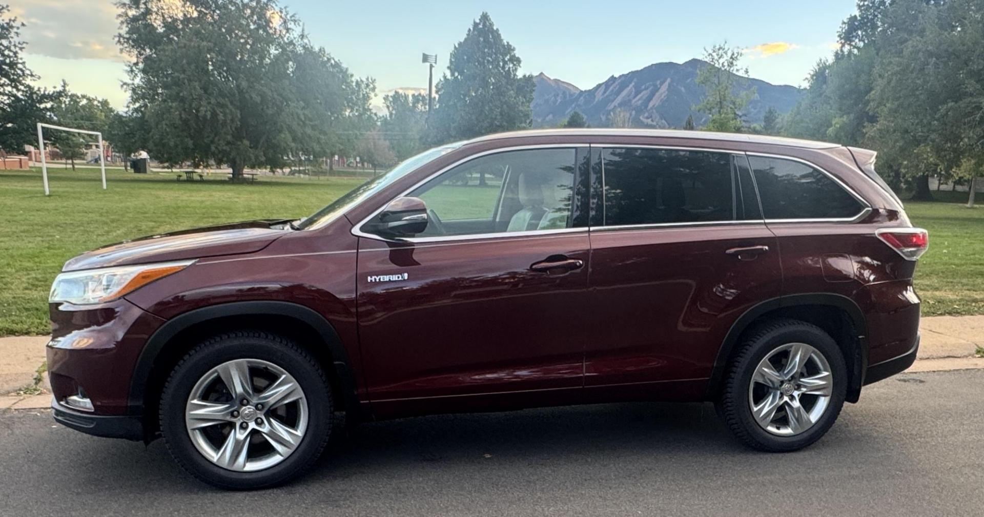 2015 Red /Tan Toyota Highlander Hybrid Limited AWD (5TDDCRFH9FS) with an 3.3L V6 DOHC 24V HYBRID engine, Continuously Variable Transmission transmission, located at 2510 47th St. Suite 200, Boulder, CO, 80301, (303) 641-0333, 40.026196, -105.243217 - This Beautiful 2015 Toyota Highlander Hybrid Limited is a recent acquisition by Boulder Motors. It is finished in Toyota’s Ooh La La Rouge Mica with Almond Perforated Leather. The Colorado title is Clean Clear. Some Features: Color-keyed rear spoiler with LED center high-mount stop light · - Photo#7