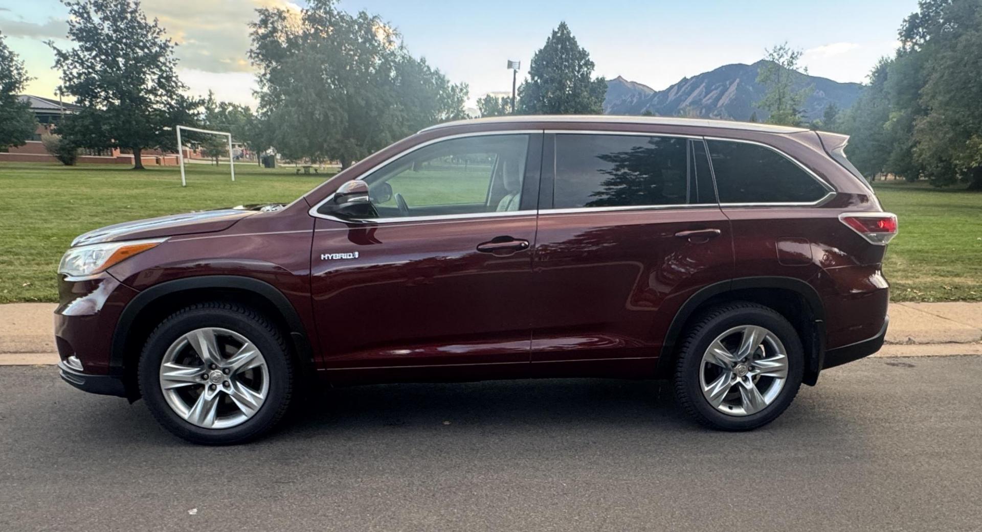 2015 Red /Tan Toyota Highlander Hybrid Limited AWD (5TDDCRFH9FS) with an 3.3L V6 DOHC 24V HYBRID engine, Continuously Variable Transmission transmission, located at 2510 47th St. Suite 200, Boulder, CO, 80301, (303) 641-0333, 40.026196, -105.243217 - This Beautiful 2015 Toyota Highlander Hybrid Limited is a recent acquisition by Boulder Motors. It is finished in Toyota’s Ooh La La Rouge Mica with Almond Perforated Leather. The Colorado title is Clean Clear. Some Features: Color-keyed rear spoiler with LED center high-mount stop light · - Photo#8