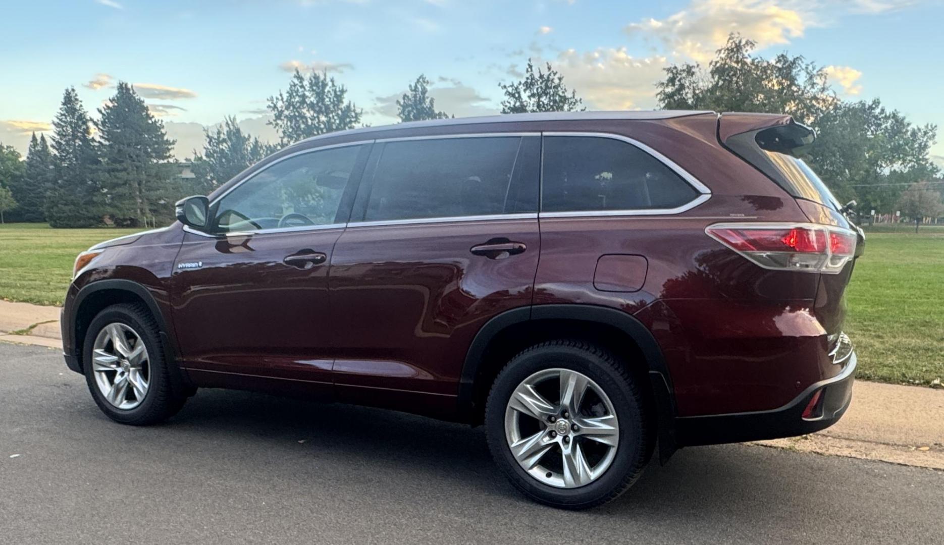 2015 Red /Tan Toyota Highlander Hybrid Limited AWD (5TDDCRFH9FS) with an 3.3L V6 DOHC 24V HYBRID engine, Continuously Variable Transmission transmission, located at 2510 47th St. Suite 200, Boulder, CO, 80301, (303) 641-0333, 40.026196, -105.243217 - This Beautiful 2015 Toyota Highlander Hybrid Limited is a recent acquisition by Boulder Motors. It is finished in Toyota’s Ooh La La Rouge Mica with Almond Perforated Leather. The Colorado title is Clean Clear. Some Features: Color-keyed rear spoiler with LED center high-mount stop light · - Photo#10