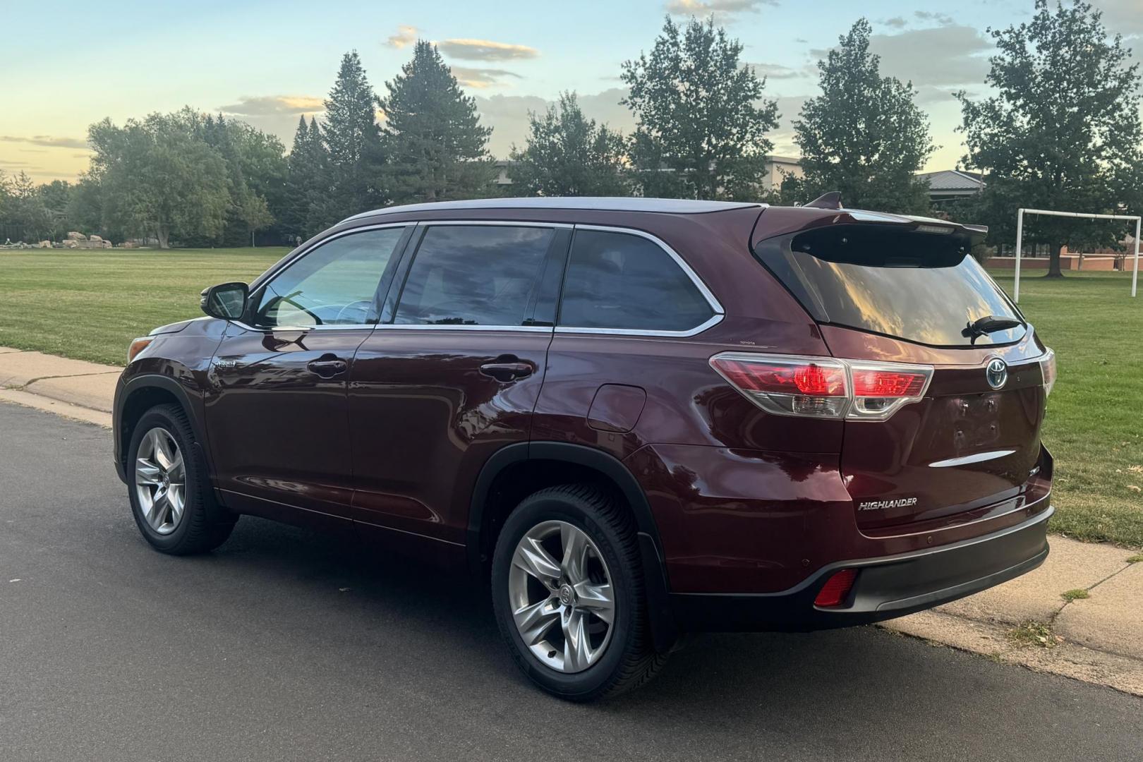 2015 Red /Tan Toyota Highlander Hybrid Limited AWD (5TDDCRFH9FS) with an 3.3L V6 DOHC 24V HYBRID engine, Continuously Variable Transmission transmission, located at 2510 47th St. Suite 200, Boulder, CO, 80301, (303) 641-0333, 40.026196, -105.243217 - This Beautiful 2015 Toyota Highlander Hybrid Limited is a recent acquisition by Boulder Motors. It is finished in Toyota’s Ooh La La Rouge Mica with Almond Perforated Leather. The Colorado title is Clean Clear. Some Features: Color-keyed rear spoiler with LED center high-mount stop light · - Photo#11