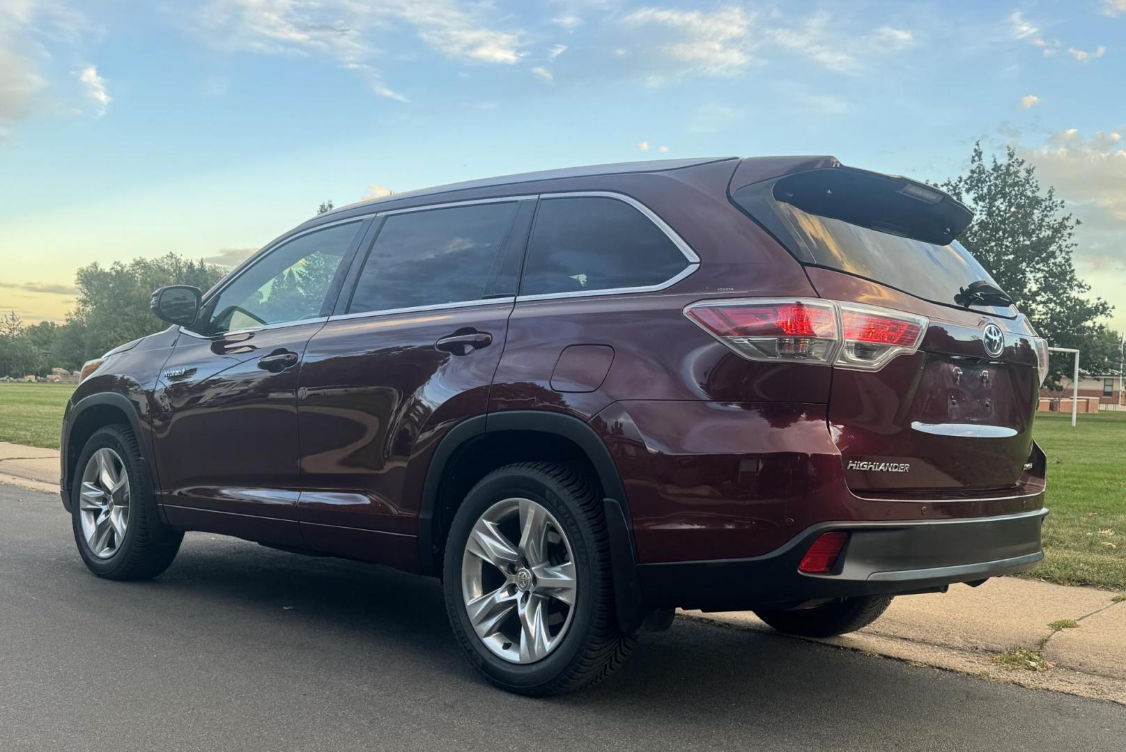 2015 Red /Tan Toyota Highlander Hybrid Limited AWD (5TDDCRFH9FS) with an 3.3L V6 DOHC 24V HYBRID engine, Continuously Variable Transmission transmission, located at 2510 47th St. Suite 200, Boulder, CO, 80301, (303) 641-0333, 40.026196, -105.243217 - This Beautiful 2015 Toyota Highlander Hybrid Limited is a recent acquisition by Boulder Motors. It is finished in Toyota’s Ooh La La Rouge Mica with Almond Perforated Leather. The Colorado title is Clean Clear. Some Features: Color-keyed rear spoiler with LED center high-mount stop light · - Photo#13