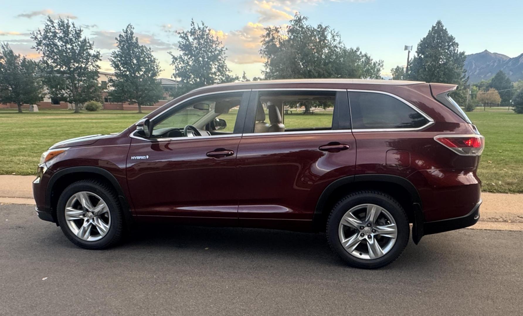 2015 Red /Tan Toyota Highlander Hybrid Limited AWD (5TDDCRFH9FS) with an 3.3L V6 DOHC 24V HYBRID engine, Continuously Variable Transmission transmission, located at 2510 47th St. Suite 200, Boulder, CO, 80301, (303) 641-0333, 40.026196, -105.243217 - This Beautiful 2015 Toyota Highlander Hybrid Limited is a recent acquisition by Boulder Motors. It is finished in Toyota’s Ooh La La Rouge Mica with Almond Perforated Leather. The Colorado title is Clean Clear. Some Features: Color-keyed rear spoiler with LED center high-mount stop light · - Photo#9