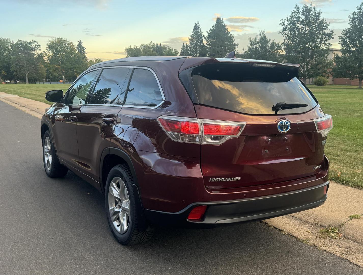 2015 Red /Tan Toyota Highlander Hybrid Limited AWD (5TDDCRFH9FS) with an 3.3L V6 DOHC 24V HYBRID engine, Continuously Variable Transmission transmission, located at 2510 47th St. Suite 200, Boulder, CO, 80301, (303) 641-0333, 40.026196, -105.243217 - This Beautiful 2015 Toyota Highlander Hybrid Limited is a recent acquisition by Boulder Motors. It is finished in Toyota’s Ooh La La Rouge Mica with Almond Perforated Leather. The Colorado title is Clean Clear. Some Features: Color-keyed rear spoiler with LED center high-mount stop light · - Photo#14