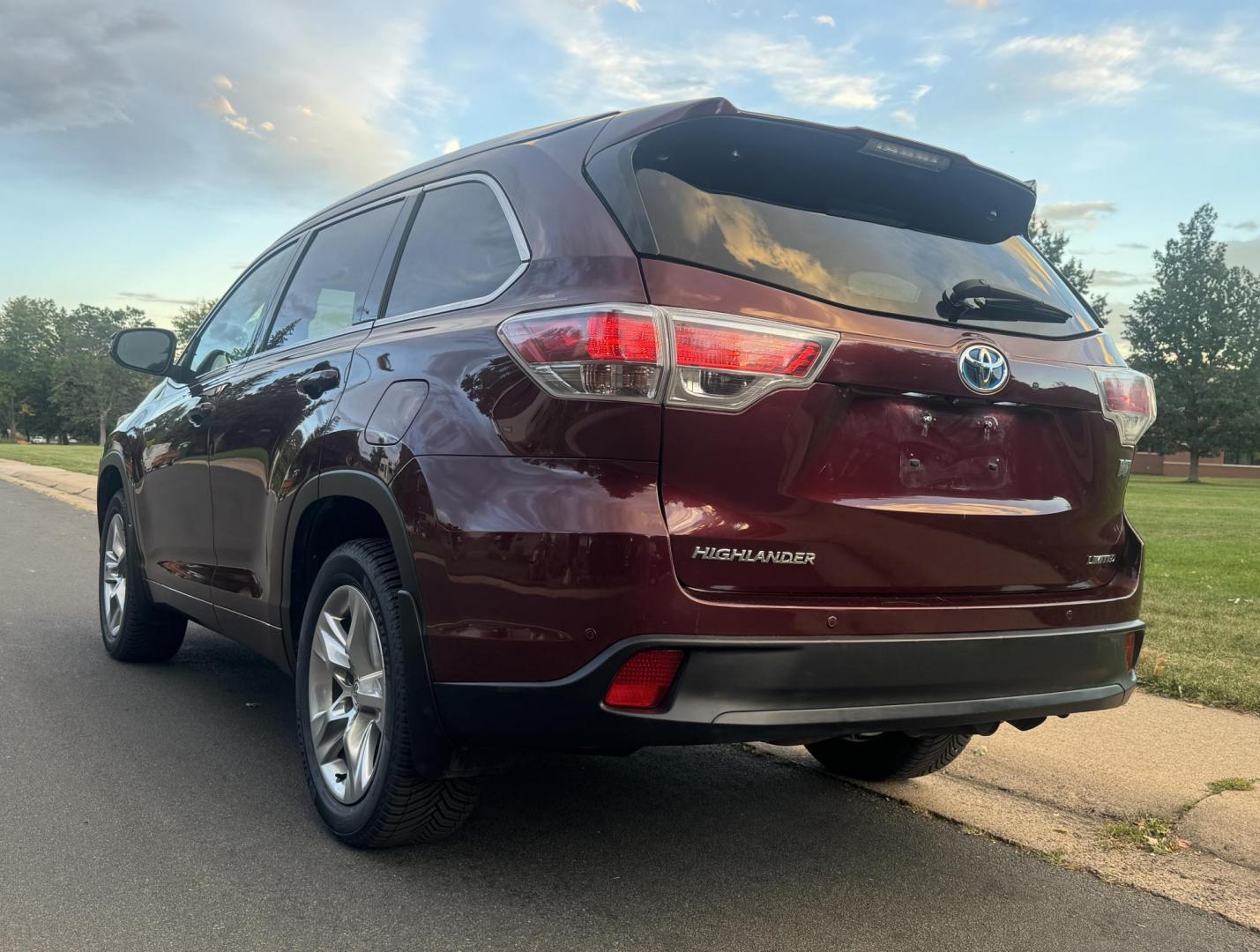 2015 Red /Tan Toyota Highlander Hybrid Limited AWD (5TDDCRFH9FS) with an 3.3L V6 DOHC 24V HYBRID engine, Continuously Variable Transmission transmission, located at 2510 47th St. Suite 200, Boulder, CO, 80301, (303) 641-0333, 40.026196, -105.243217 - This Beautiful 2015 Toyota Highlander Hybrid Limited is a recent acquisition by Boulder Motors. It is finished in Toyota’s Ooh La La Rouge Mica with Almond Perforated Leather. The Colorado title is Clean Clear. Some Features: Color-keyed rear spoiler with LED center high-mount stop light · - Photo#16