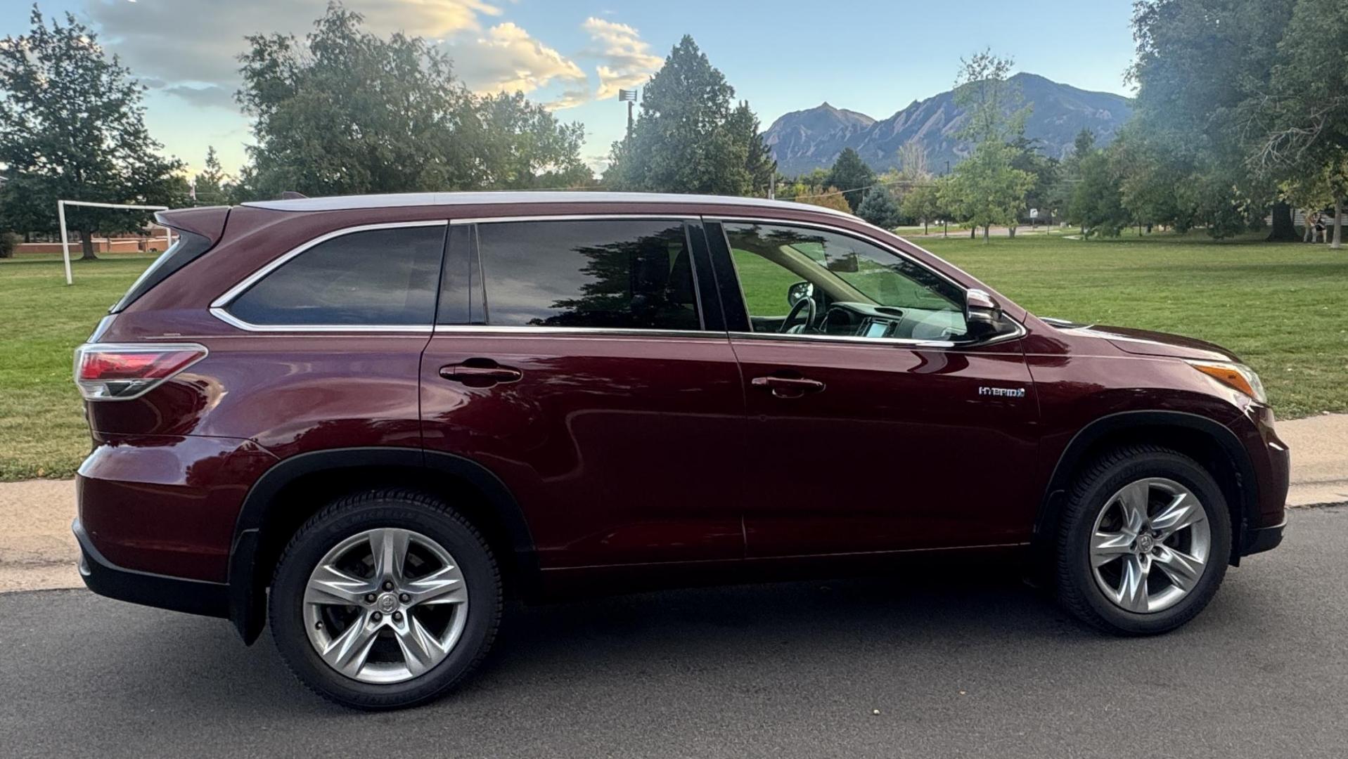 2015 Red /Tan Toyota Highlander Hybrid Limited AWD (5TDDCRFH9FS) with an 3.3L V6 DOHC 24V HYBRID engine, Continuously Variable Transmission transmission, located at 2510 47th St. Suite 200, Boulder, CO, 80301, (303) 641-0333, 40.026196, -105.243217 - This Beautiful 2015 Toyota Highlander Hybrid Limited is a recent acquisition by Boulder Motors. It is finished in Toyota’s Ooh La La Rouge Mica with Almond Perforated Leather. The Colorado title is Clean Clear. Some Features: Color-keyed rear spoiler with LED center high-mount stop light · - Photo#21