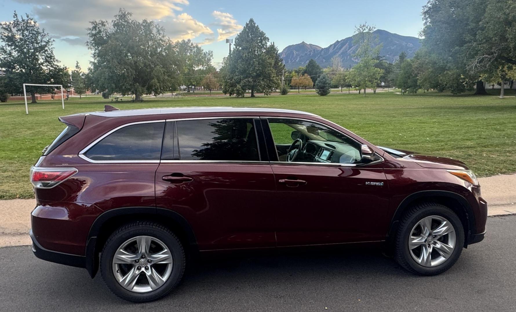 2015 Red /Tan Toyota Highlander Hybrid Limited AWD (5TDDCRFH9FS) with an 3.3L V6 DOHC 24V HYBRID engine, Continuously Variable Transmission transmission, located at 2510 47th St. Suite 200, Boulder, CO, 80301, (303) 641-0333, 40.026196, -105.243217 - This Beautiful 2015 Toyota Highlander Hybrid Limited is a recent acquisition by Boulder Motors. It is finished in Toyota’s Ooh La La Rouge Mica with Almond Perforated Leather. The Colorado title is Clean Clear. Some Features: Color-keyed rear spoiler with LED center high-mount stop light · - Photo#22