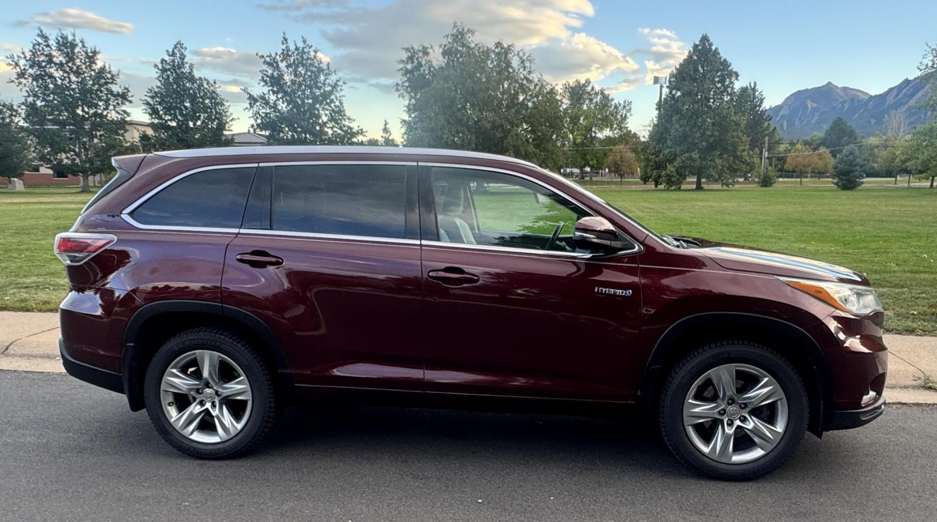 2015 Red /Tan Toyota Highlander Hybrid Limited AWD (5TDDCRFH9FS) with an 3.3L V6 DOHC 24V HYBRID engine, Continuously Variable Transmission transmission, located at 2510 47th St. Suite 200, Boulder, CO, 80301, (303) 641-0333, 40.026196, -105.243217 - This Beautiful 2015 Toyota Highlander Hybrid Limited is a recent acquisition by Boulder Motors. It is finished in Toyota’s Ooh La La Rouge Mica with Almond Perforated Leather. The Colorado title is Clean Clear. Some Features: Color-keyed rear spoiler with LED center high-mount stop light · - Photo#23