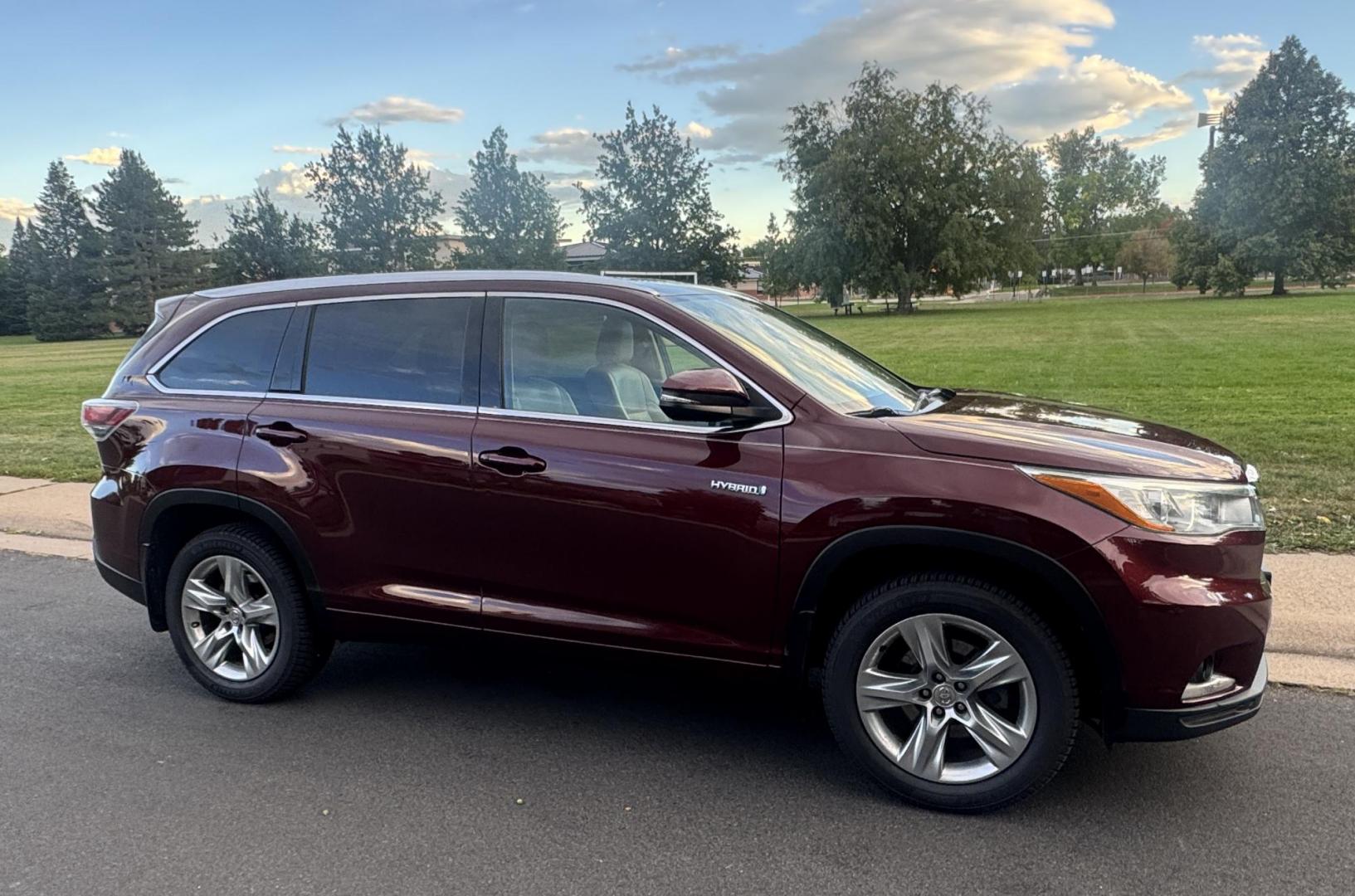 2015 Red /Tan Toyota Highlander Hybrid Limited AWD (5TDDCRFH9FS) with an 3.3L V6 DOHC 24V HYBRID engine, Continuously Variable Transmission transmission, located at 2510 47th St. Suite 200, Boulder, CO, 80301, (303) 641-0333, 40.026196, -105.243217 - This Beautiful 2015 Toyota Highlander Hybrid Limited is a recent acquisition by Boulder Motors. It is finished in Toyota’s Ooh La La Rouge Mica with Almond Perforated Leather. The Colorado title is Clean Clear. Some Features: Color-keyed rear spoiler with LED center high-mount stop light · - Photo#24