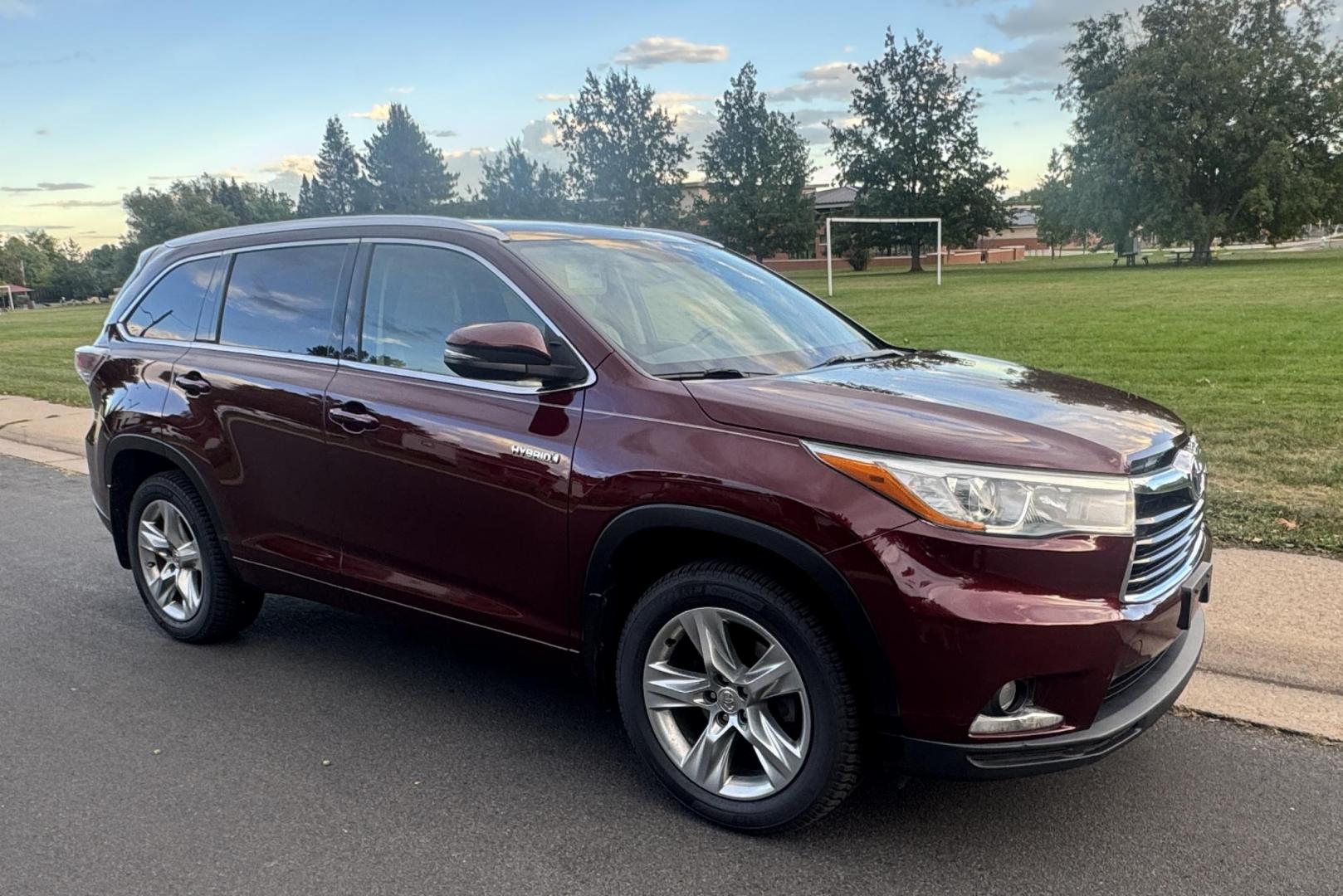 2015 Red /Tan Toyota Highlander Hybrid Limited AWD (5TDDCRFH9FS) with an 3.3L V6 DOHC 24V HYBRID engine, Continuously Variable Transmission transmission, located at 2510 47th St. Suite 200, Boulder, CO, 80301, (303) 641-0333, 40.026196, -105.243217 - This Beautiful 2015 Toyota Highlander Hybrid Limited is a recent acquisition by Boulder Motors. It is finished in Toyota’s Ooh La La Rouge Mica with Almond Perforated Leather. The Colorado title is Clean Clear. Some Features: Color-keyed rear spoiler with LED center high-mount stop light · - Photo#25