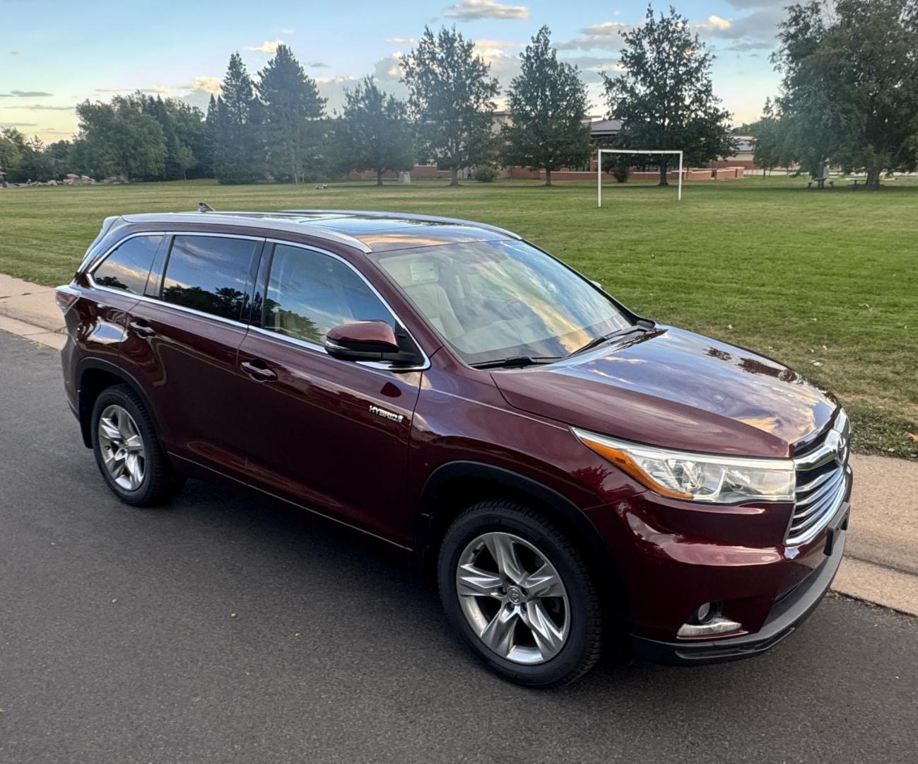 2015 Red /Tan Toyota Highlander Hybrid Limited AWD (5TDDCRFH9FS) with an 3.3L V6 DOHC 24V HYBRID engine, Continuously Variable Transmission transmission, located at 2510 47th St. Suite 200, Boulder, CO, 80301, (303) 641-0333, 40.026196, -105.243217 - This Beautiful 2015 Toyota Highlander Hybrid Limited is a recent acquisition by Boulder Motors. It is finished in Toyota’s Ooh La La Rouge Mica with Almond Perforated Leather. The Colorado title is Clean Clear. Some Features: Color-keyed rear spoiler with LED center high-mount stop light · - Photo#26