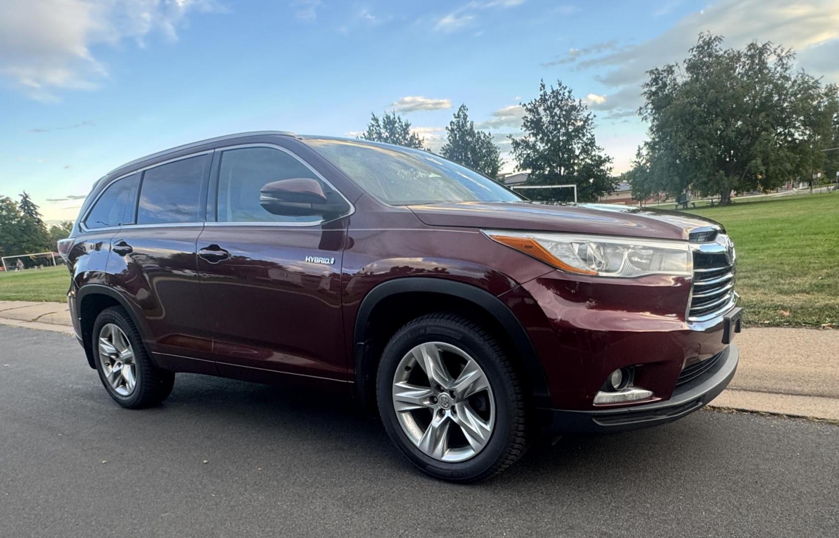2015 Red /Tan Toyota Highlander Hybrid Limited AWD (5TDDCRFH9FS) with an 3.3L V6 DOHC 24V HYBRID engine, Continuously Variable Transmission transmission, located at 2510 47th St. Suite 200, Boulder, CO, 80301, (303) 641-0333, 40.026196, -105.243217 - This Beautiful 2015 Toyota Highlander Hybrid Limited is a recent acquisition by Boulder Motors. It is finished in Toyota’s Ooh La La Rouge Mica with Almond Perforated Leather. The Colorado title is Clean Clear. Some Features: Color-keyed rear spoiler with LED center high-mount stop light · - Photo#27