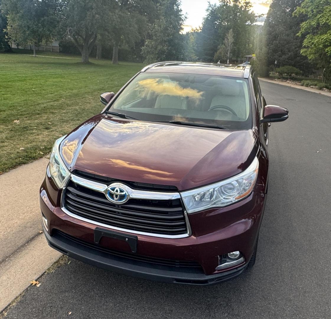 2015 Red /Tan Toyota Highlander Hybrid Limited AWD (5TDDCRFH9FS) with an 3.3L V6 DOHC 24V HYBRID engine, Continuously Variable Transmission transmission, located at 2510 47th St. Suite 200, Boulder, CO, 80301, (303) 641-0333, 40.026196, -105.243217 - This Beautiful 2015 Toyota Highlander Hybrid Limited is a recent acquisition by Boulder Motors. It is finished in Toyota’s Ooh La La Rouge Mica with Almond Perforated Leather. The Colorado title is Clean Clear. Some Features: Color-keyed rear spoiler with LED center high-mount stop light · - Photo#31