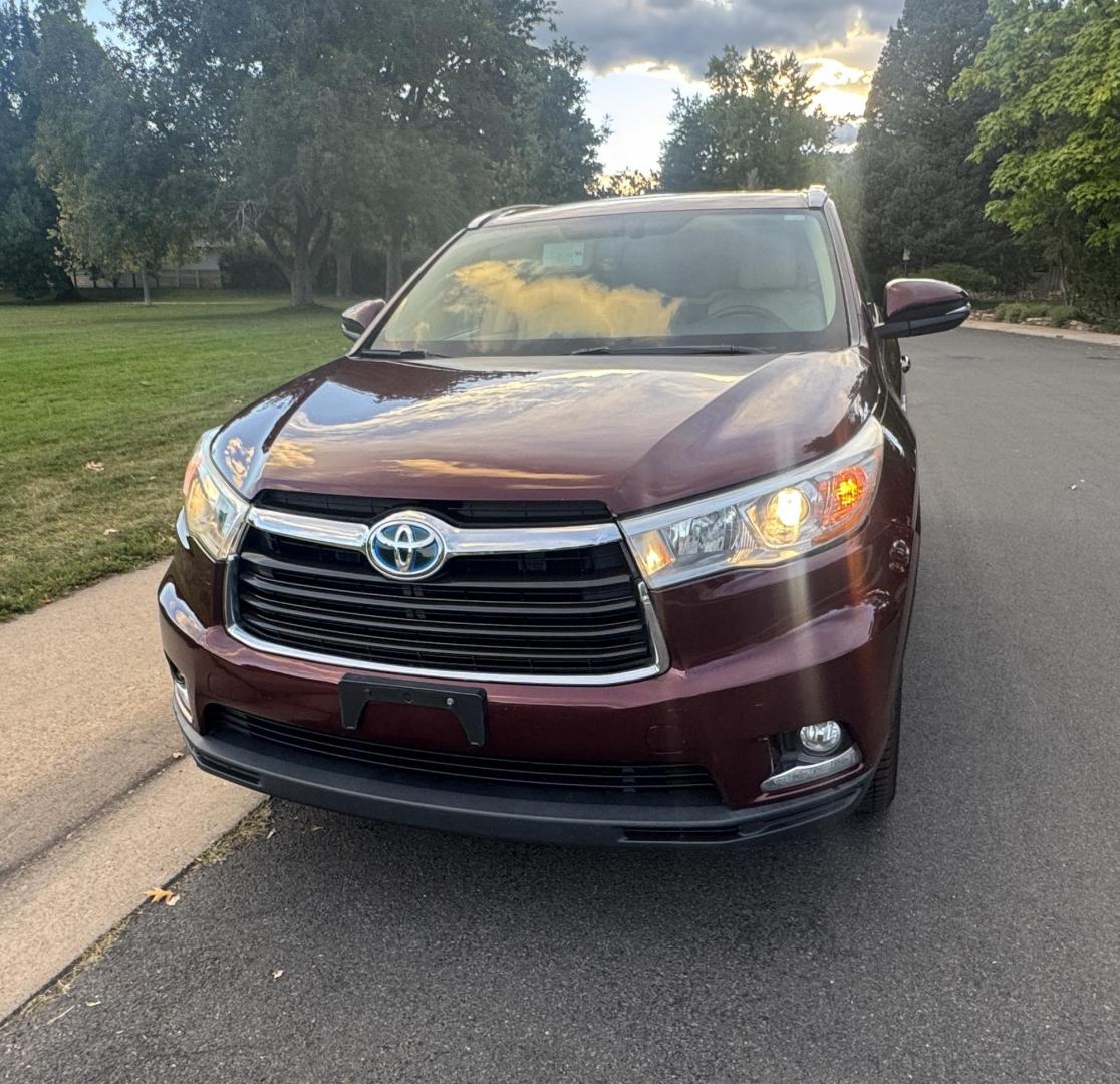 2015 Red /Tan Toyota Highlander Hybrid Limited AWD (5TDDCRFH9FS) with an 3.3L V6 DOHC 24V HYBRID engine, Continuously Variable Transmission transmission, located at 2510 47th St. Suite 200, Boulder, CO, 80301, (303) 641-0333, 40.026196, -105.243217 - This Beautiful 2015 Toyota Highlander Hybrid Limited is a recent acquisition by Boulder Motors. It is finished in Toyota’s Ooh La La Rouge Mica with Almond Perforated Leather. The Colorado title is Clean Clear. Some Features: Color-keyed rear spoiler with LED center high-mount stop light · - Photo#30