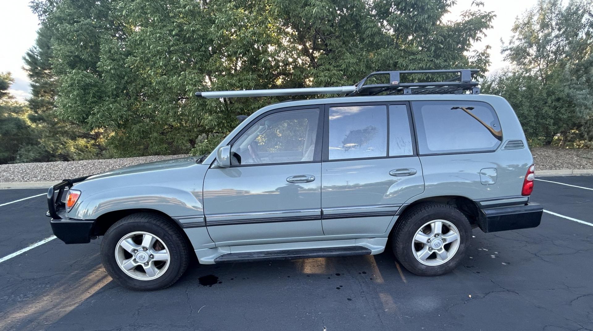 2003 Blue /Gray Toyota Land Cruiser 4WD (JTEHT05J932) with an 4.7L V8 DOHC 32V engine, 5A OD transmission, located at 2510 47th St. Suite 200, Boulder, CO, 80301, (303) 641-0333, 40.026196, -105.243217 - This Amazing, Toyota Serviced Land Cruiser is a Recent Acquisition by Boulder Motors of Boulder Colorado. Corwin Toyota Boulder Completed a Fresh Synthetic Service and Inspection 12/16/2025 At Our Listed Price This great 2003 Land Cruiser qualifies for our Certified Limited Drivetrain Warranty.- Photo#1